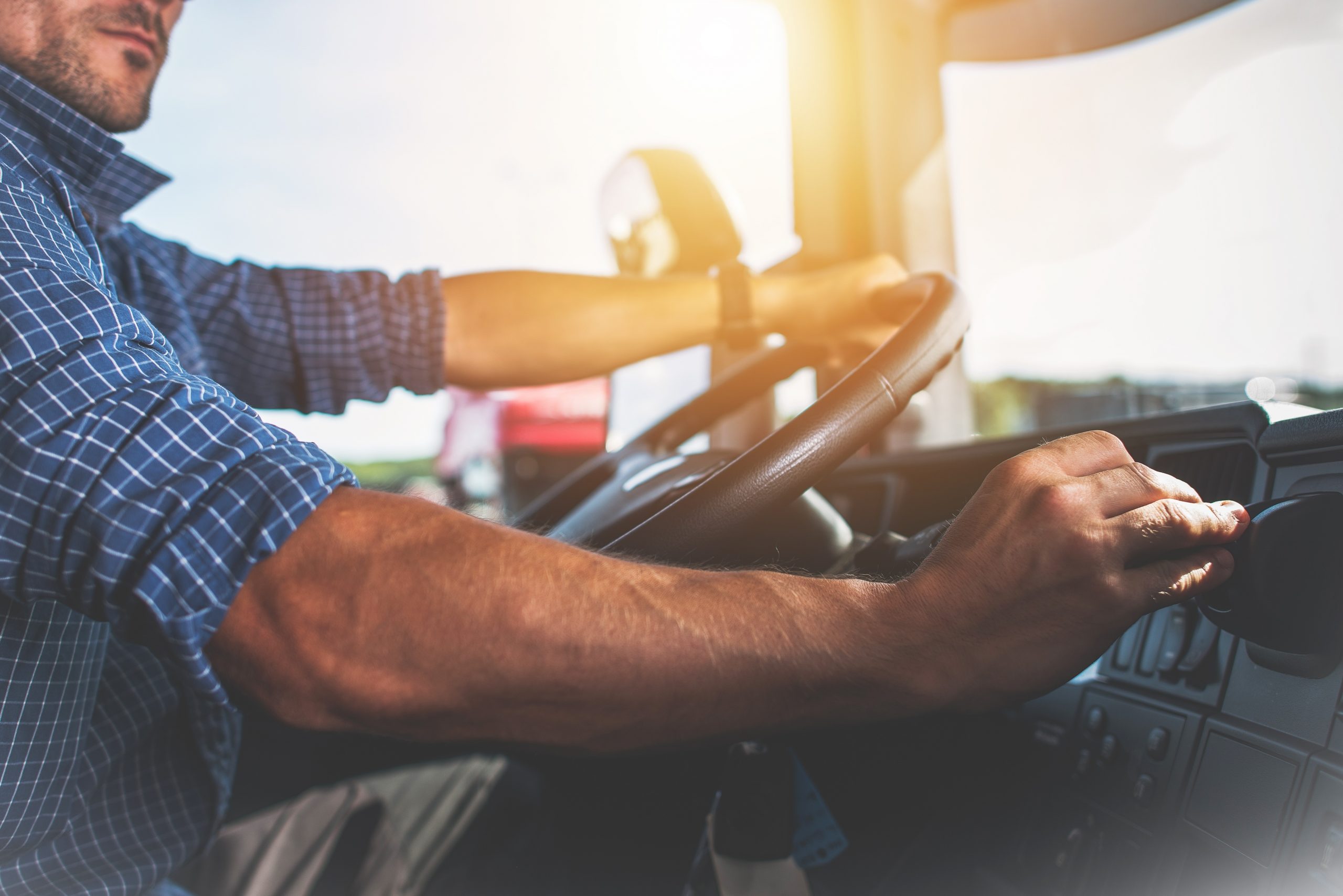 Truck driver adjusting gears